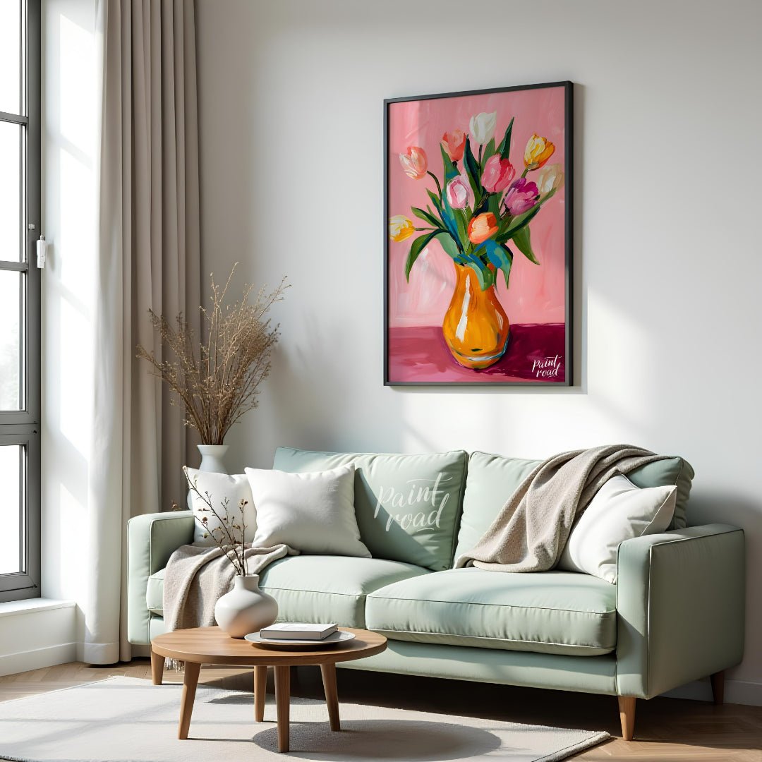 This charming artwork features a bouquet of tulips in a vibrant orange vase, set against a soft pin… for living room