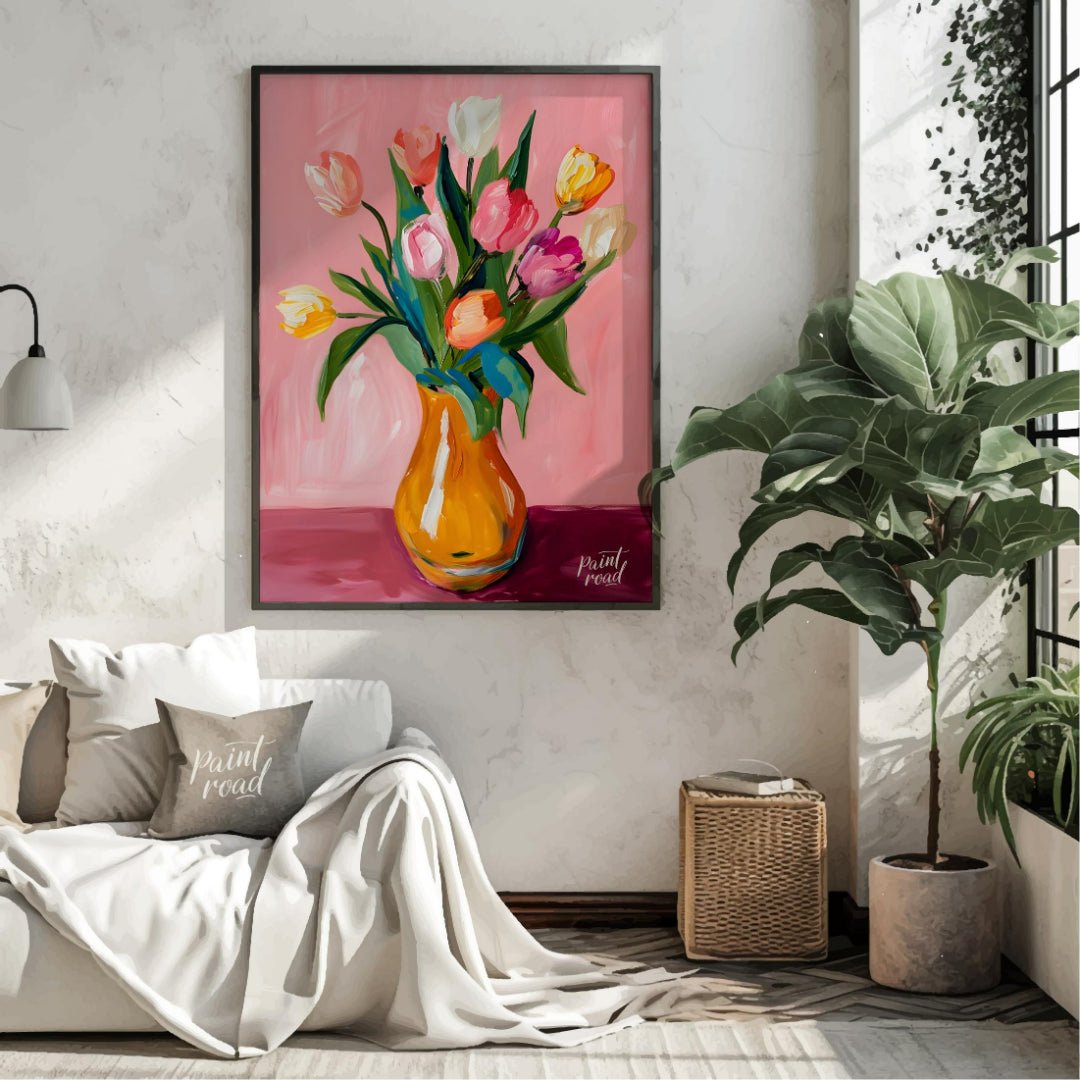 This charming artwork features a bouquet of tulips in a vibrant orange vase, set against a soft pin… for living room