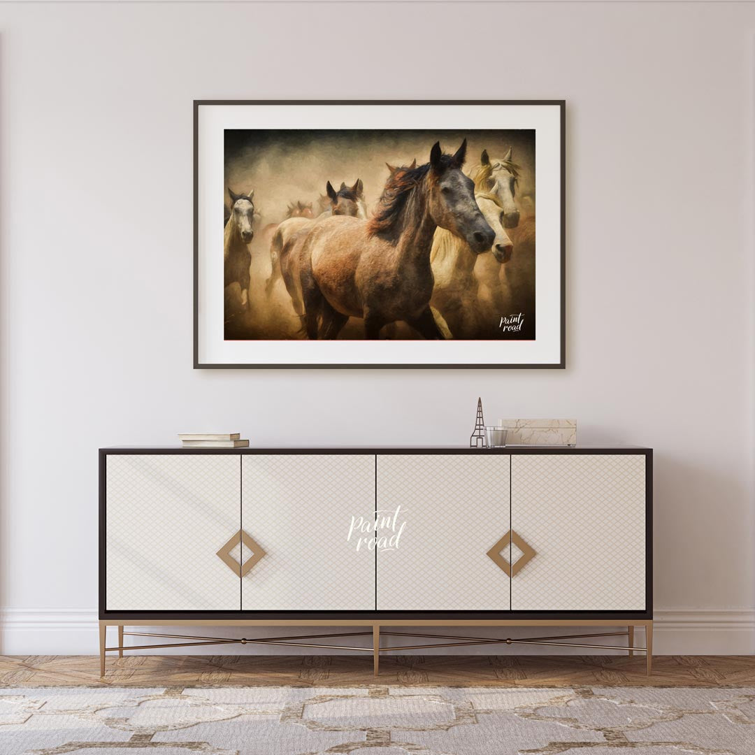 This captivating artwork portrays a herd of wild horses running through a dusty landscape, creating… for living room