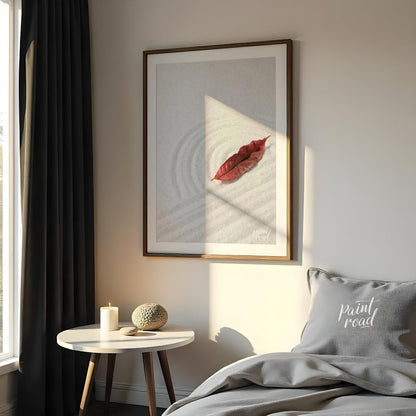 “Zen Leaf” captures a single, vibrant red autumn leaf resting delicately on a bed of pristine white… for bedroom