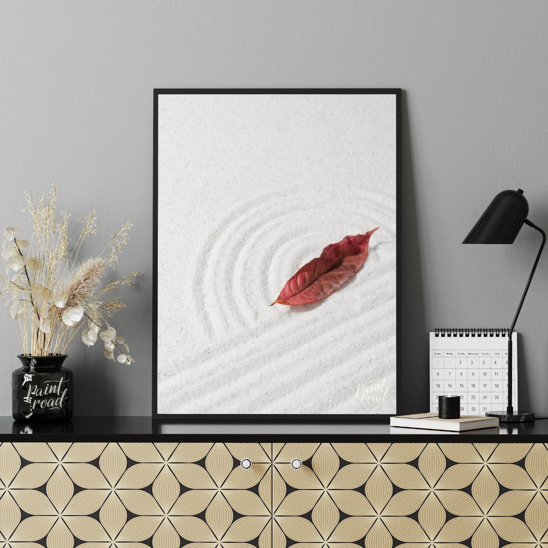 “Zen Leaf” captures a single, vibrant red autumn leaf resting delicately on a bed of pristine white… for office