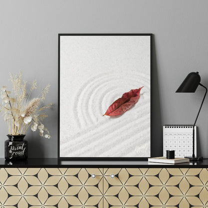 “Zen Leaf” captures a single, vibrant red autumn leaf resting delicately on a bed of pristine white… for office
